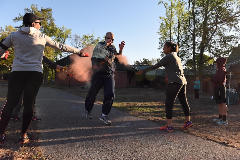 Volunteers cover Chief Master Sgt. Todd Cole, 628th Air Base Wing command chief, with colored chalk during a color run hosted by the Sexual Assault Prevention and Response office, at Joint Base Charleston, South Carolina April 7, 2017. The run was held as part of Sexual Assault Awareness and Prevention Month, which focuses on creating an appropriate culture to eliminate sexual assault.