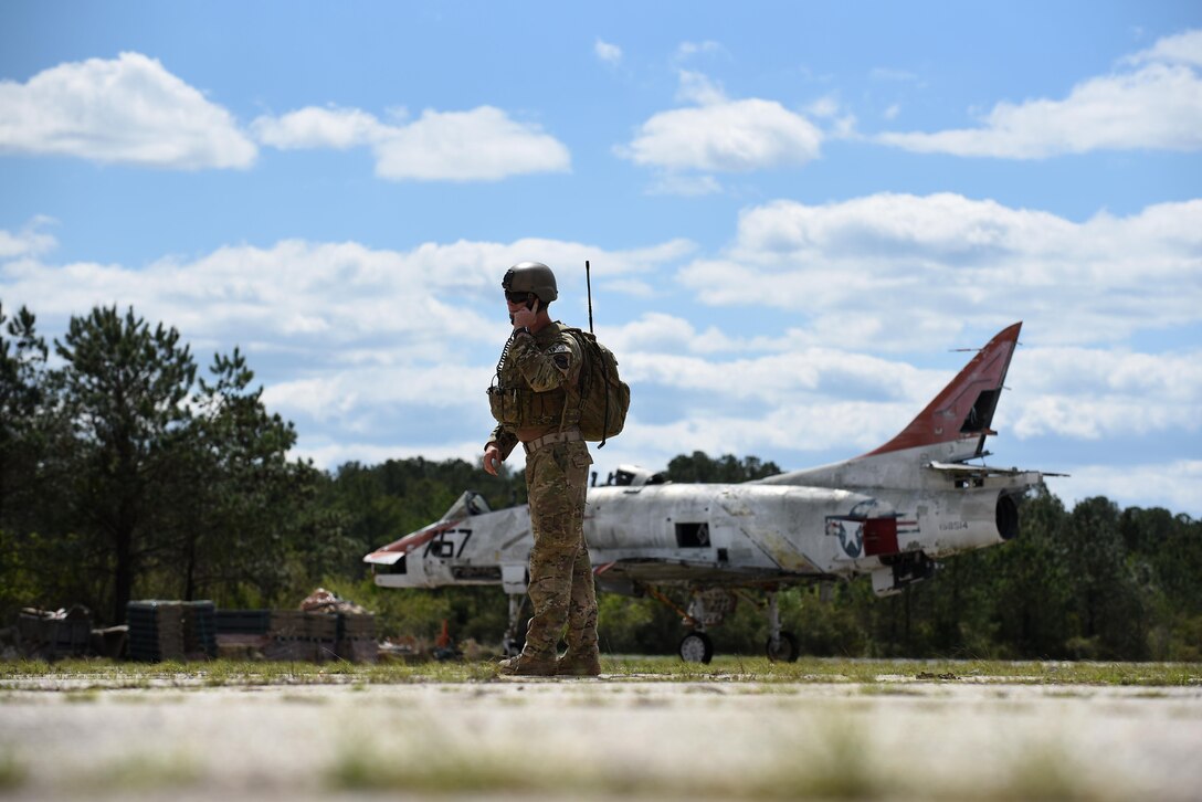 Airman 1st Class Seth Elich, 14th Air Support Operations Squadron tactical air control party, listens to communications during exercise Razor Talon, April 7, 2017, at Atlantic Field Marine Corps Outlying Field, North Carolina. Razor Talon was created by the 4th Fighter Wing in March 2011 to prepare and sharpen the skills of aircrew for real-world missions. (U.S. Air Force photo by Airman 1st Class Kenneth Boyton)