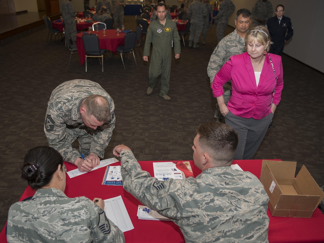 Chief Master Sgt. Benjamin Hedden, 80th Flying Training Wing command chief, signs one of the first donations to this year’s Air Force Assistance Fund Campaign at Sheppard Air Force Base, Texas, April 10, 2017. The contributions made to the AFAF Campaign help Airmen, families and retirees by providing services such as support for emergency needs, educational assistance and family support to include comfort to Air Force widows. (U.S. Air Force photo by Staff Sgt. Kyle E. Gese)