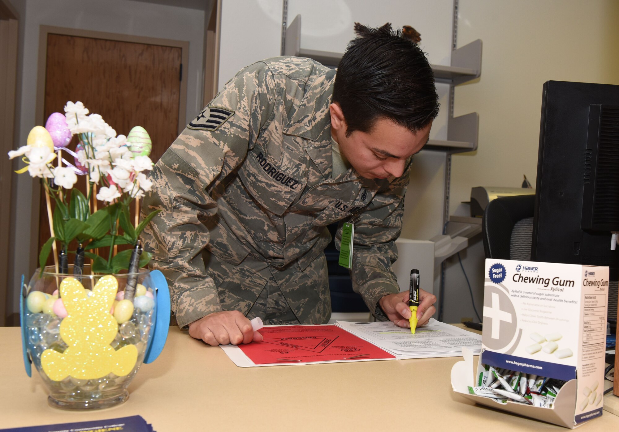Staff Sgt. Richard Rodriguez, 90th Medical Operations Squadron dental support NCO in charge, checks Personnel Reliability Assurance Program paperwork at F.E. Warren Air Force Base, Wyo., April 6, 2017. The dental clinic plays a key role in ensuring that Airmen are fit to support the nuclear deterrence mission. (U.S. Air Force photo by Airman 1st Class Breanna Carter)