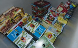 Airmen from the 301st and 381st intelligence squadrons donate close to 4,000 items of canned food and other family needs to the Armed Services YMCA of Alaska at Joint Base Elmendorf-Richardson, Alaska, April 6, 2017. The two squadrons had a friendly competition to donate the most. 