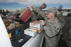 Airmen from the 301st and 381st intelligence squadrons donate close to 4,000 items of canned food and other family needs to the Armed Services YMCA of Alaska at Joint Base Elmendorf-Richardson, Alaska, April 6, 2017. The two squadrons had a friendly competition to donate the most. 