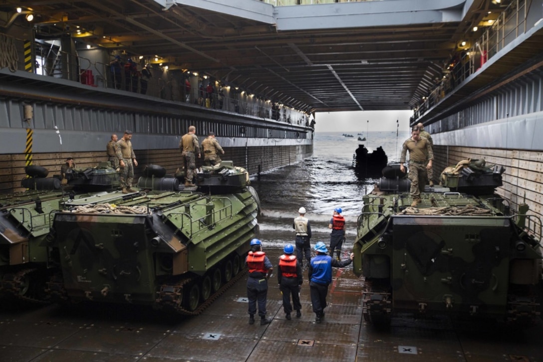 Marines with Battalion Landing Team, 2nd Battalion, 5th Marines, drive an AAV-P7/A1 assault amphibious vehicle in the well deck of USS Ashland (LSD 48) off the coast of Okinawa, Japan, March 8, 2017. BLT 2/5 is currently aboard ships of the Bonhomme Richard Amphibious Ready Group as part of the 31st Marine Expeditionary Unit's regularly scheduled spring patrol. As the Marine Corps’ only continuously forward deployed unit, the 31st MEU’s air-ground-logistics team provides a flexible force, ready to perform a wide range of military operations, from limited combat to humanitarian assistance operations, throughout the Indo-Asia-Pacific region. (U.S. Marine Corps photo by Lance Cpl. Breanna L. Weisenberger)