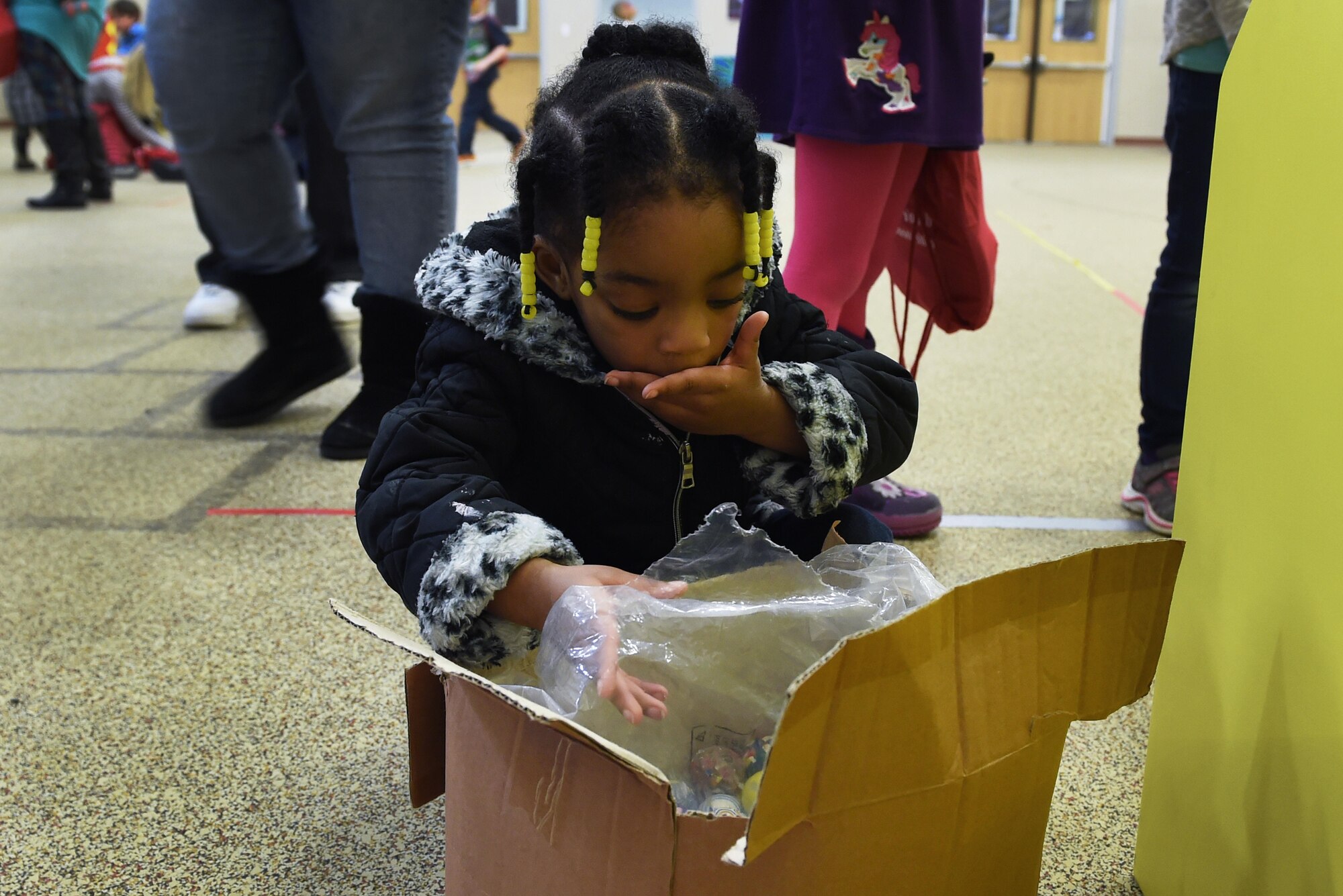 Ashley Gibson, 3, chooses a prize after winning a game at the Month of the Military Child Kick-Off Celebration at the Illa School Age Center at Joint Base Elmendorf-Richardson, Alaska, March 31, 2017. The Month of the Military Child honors the important role military children play in the armed forces community. 
