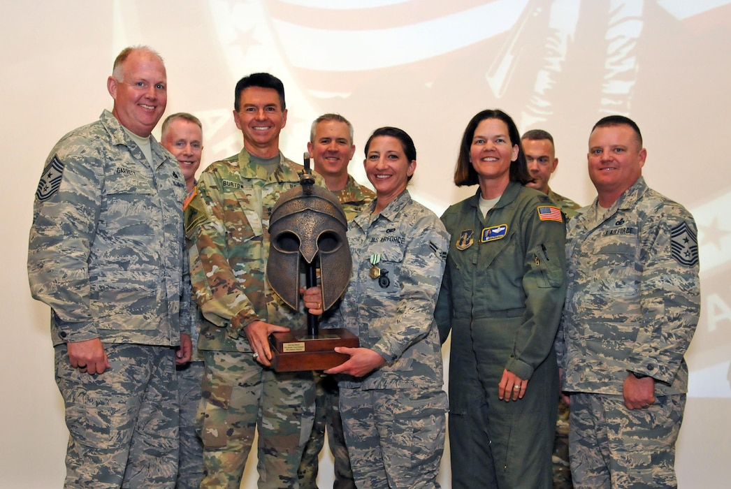 Airman 1st Class Kelley Barney, a member of the 151st Security Forces Squadron, accepts an award after earning the title of the Utah National Guard's Best Warrior in the junior enlisted category at Camp Williams, Utah on April 9, 2017. (U.S. Air National Guard photo by Tech. Sgt. Annie Edwards)