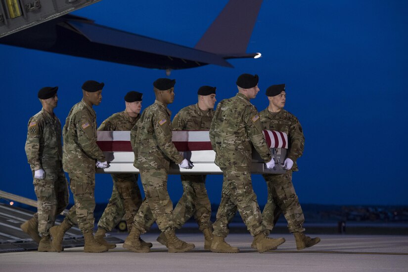 A U.S. Army carry team transfers the remains of Army Staff Sgt. Mark R. De Alencar of Edgewood, Md., April 10, 2017, at Dover Air Force Base, Del. De Alencar was assigned to the 1st Battalion, 7th Special Forces Group (Airborne), Eglin Air Force Base, Fla. (U.S. Air Force photo by Senior Airman Aaron J. Jenne)