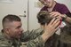 U.S. Air Force Maj. Justin Read, the 35th Medical Operations Squadron pharmacy operations chief, looks into the eyes of his dog, Rosie, during a veterinary appointment at Misawa Air Base, Japan, April 5, 2017. Along with Rosie, Read brought his other dog, Ella, to receive routine vaccinations and a checkup. To make appointments with the veterinary clinic call DSN 226-4502. (U.S. Air Force photo by Airman 1st Class Sadie Colbert)