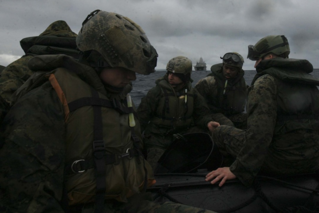 Marines with Fox Company, Battalion Landing Team, 2nd Battalion, 5th Marines, 31st Marine Expeditionary Unit, rig and tow combat rubber raiding crafts during a launch and recovery training off the coast of Okinawa, Japan, March 10, 2017. The 31st MEU is currently aboard ships of the Bonhomme Richard Amphibious Ready Group as part of the 31st MEU's regularly scheduled spring patrol. As the Marine Corps' only continuously forward-deployed unit, the 31st Marine Expeditionary Unit's air-ground-logistics team provides a flexible force, ready to perform a wide range of military operations, from limited combat to humanitarian assistance operations, throughout the Indo-Asia-Pacific region. (U.S. Marine Corps photo by Lance Cpl. Jorge A. Rosales) 