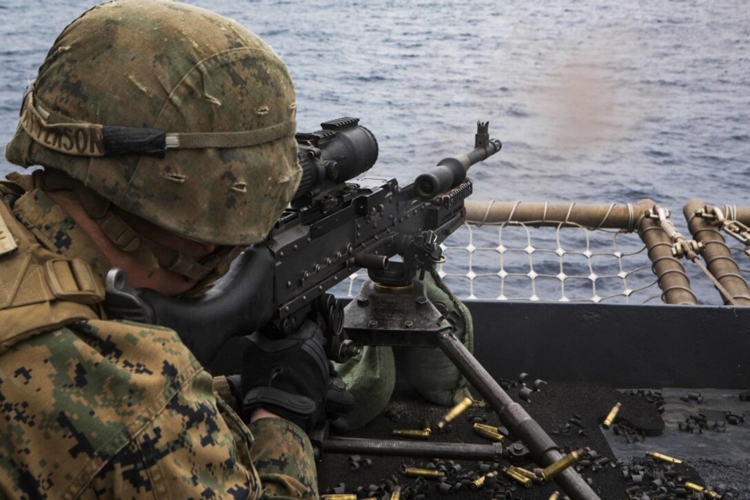 Lance Cpl. Dakota Patterson, a machine gunner with Echo Co., Battalion Landing Team, 2nd Battalion, 5th Marines, 31st Marine Expeditionary Unit, fires an M240G medium machine gun during a Defense Amphibious Task Force drill on the flight deck of USS Ashland (LSD 48), in the Pacific Ocean, March 10, 2017. The DATF integrates Marine Corps and Navy firepower into a joint defense of the naval ship. As the Marine Corps' only continuously forward-deployed unit, the 31st MEU air-ground-logistics team provides a flexible force, ready to perform a wide range of military operations, from limited combat to humanitarian assistance operations, throughout the Indo-Asia Pacific region. (U.S. Marine Corps photo by Cpl. Darien J. Bjorndal) 