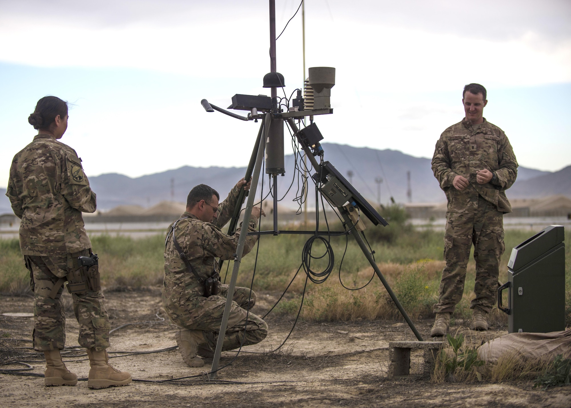 Members of the 455th Expeditionary Operations Support Squadron conduct an inspection of a Tactical Meteorological Observation System, or TMQ-53, at Bagram Airfield, Afghanistan, May 16, 2016. The TMQ-53 collects weather data that includes wind speed and direction, temperature, humidity, cloud height, precipitation and lightning. This data is compiled with more than 100 years of climatological observations stored by the 14th Weather Squadron in Asheville, North Carolina. (U.S. Air Force photo by Senior Airman Justyn M. Freeman)