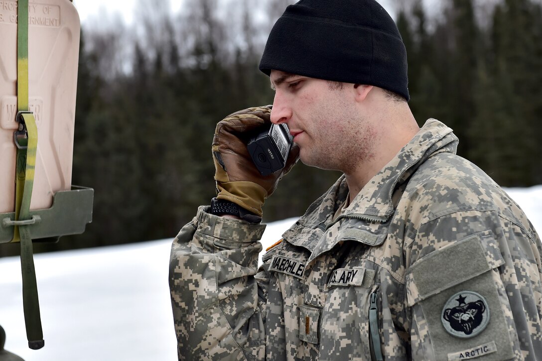 Army 2nd Lt. Jacob Maechler checks his radio before a live-fire gunnery exercise at Joint Base Elmendorf-Richardson, Alaska, April 5, 2017. Maechler is assigned to the 95th Chemical Company. Air Force photo by Justin Connaher