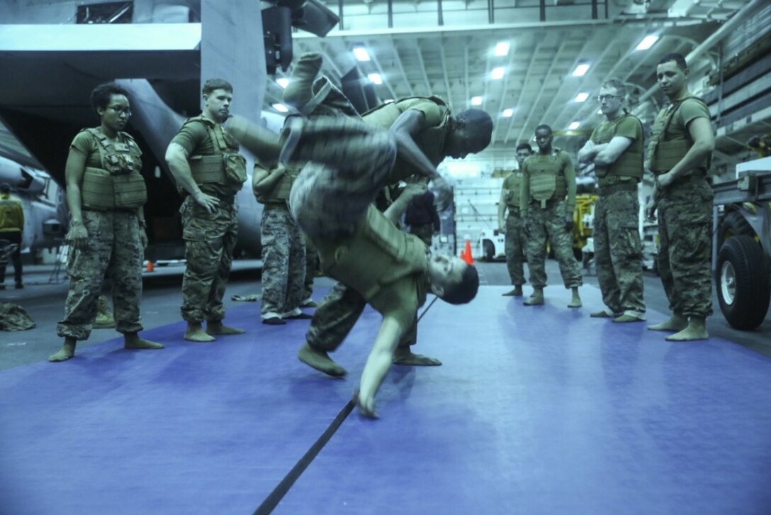 Sgt. Isaih Hart (left), a radio operator with Command Element, 31st Marine Expeditionary Unit, demonstrates a hip throw during Marine Corps Martial Arts Program training aboard the USS Bonhomme Richard (LHD 6), in the Pacific Ocean, March 12, 2017. Marines from each element of the 31st MEU underwent MCMAP training during the 31st MEU’s 17.1 Spring Patrol of the Asia-Pacific region. As the Marine Corps’ only continuously forward deployed unit, the 31st Marine Expeditionary Unit’s air-ground-logistics team provides a flexible force, ready to perform a wide range of military operations, from limited combat to humanitarian assistance operations, throughout the Asia-Pacific region. (U.S. Marine Corps photo by Sgt. Tiffany Edwards/Released) 