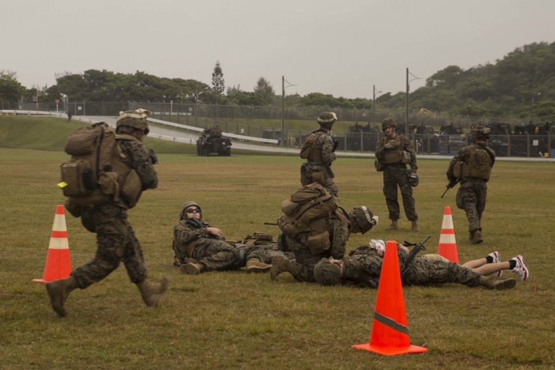 A corpsman with Combat Logistics Battalion 31 rushes to simulated casualties during training at Camp Hansen, Okinawa, Japan, March 13, 2017. During Noncombatant Evacuation Operations, Marines and Sailors with CLB-31 establish an evacuation control center to facilitate screening procedures, which helps protect noncombatants from dangerous environments and helps the battalion provide life-saving care to evacuees. As the Marine Corps’ only continuously forward deployed unit, the 31st MEU's air-ground-logistics team provides a flexible force, ready to perform a wide range of military operations, from limited combat to humanitarian assistance operations, throughout the Indo-Asia-Pacific region. (U.S. Marine Corps photo by Lance Cpl. Breanna L. Weisenberger/Released)