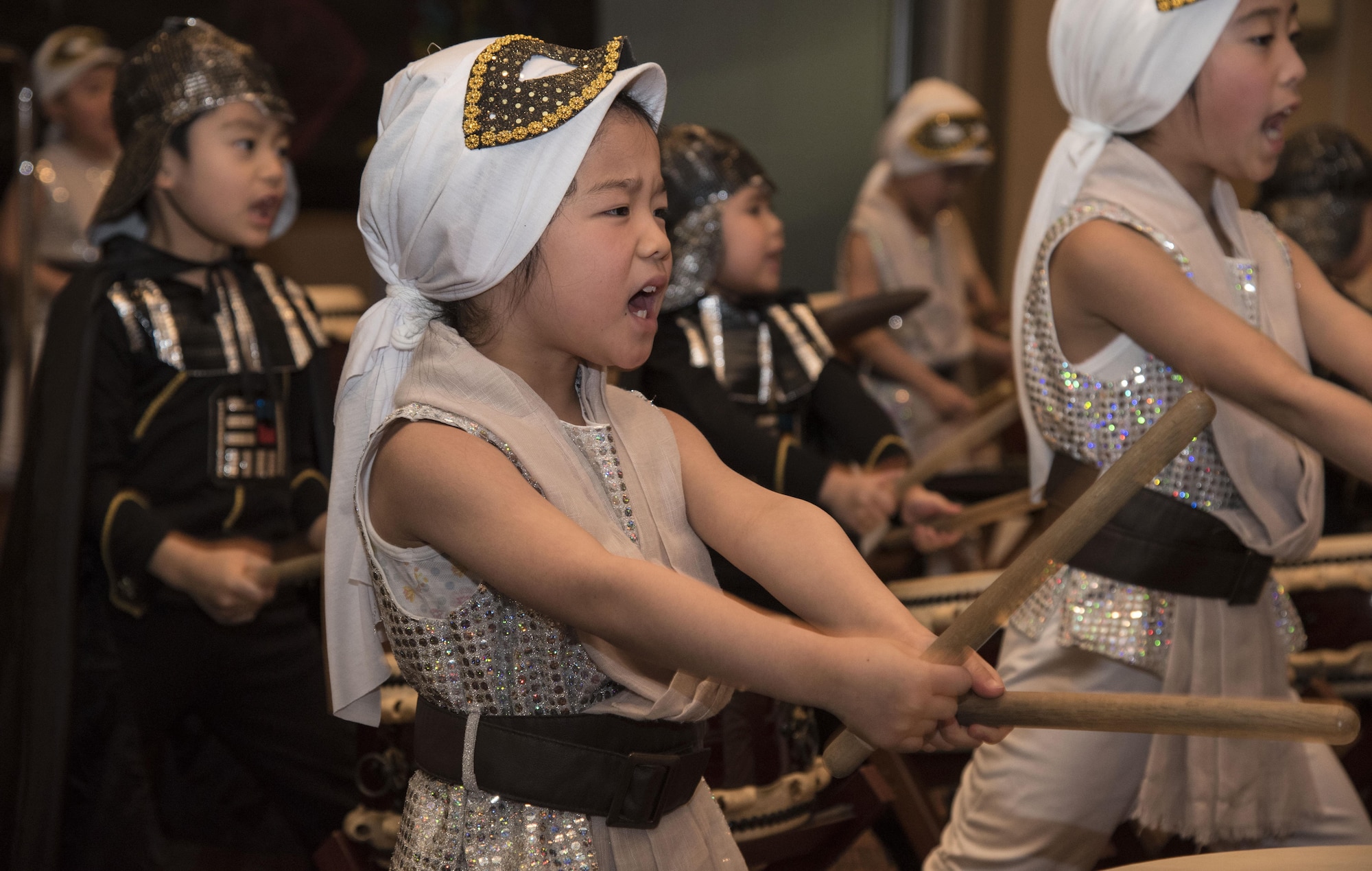 Kanon, a Makibano Kids Drums taiko drummer, plays the taiko during the 30th Annual Japan Day at Misawa Air Base, Japan, April 8, 2017. The event featured many performances including a dragon dance, shoto show and a Star Wars themed drum performance. (U.S. Air Force photo by Airman 1st Class Sadie Colbert)
