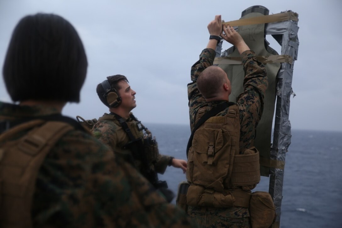U.S. Marines with Combat Logistics Battalion (CLB) 31, 31st Marine Expeditionary Unit, construct targets for a deck shoot aboard the USS Bonhomme Richard (LHD 6), in the Pacific Ocean, March 14, 2017. Marines with CLB-31, 31st MEU underwent combat marksmanship training as a part of the 31st MEU’s 17.1 Spring Patrol of the Asia-Pacific region. As the Marine Corps’ only continuously forward deployed unit, the 31st MEU’s air-ground-logistics team provides a flexible force, ready to perform a wide range of military operations, from limited combat to humanitarian assistance operations, throughout the Asia-Pacific region. (U.S. Marine Corps photo by Sgt. Tiffany Edwards) 