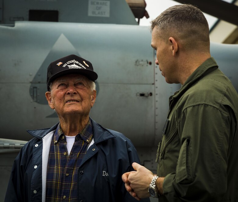 Lt. Col. Bryan G. Swenson gives Donald Irwin, a United States Navy World War II veteran, a tour of the MV-22 Osprey, April 7, 2017 on Marine Corps Air Station Futenma, Okinawa, Japan. Irwin took part in battles for Midway, Guadalcanal, and survived the sinking of the USS Colhoun during the battle for Okinawa. Irwin decided to return to Okinawa and exchange stories with the Marines and Sailors stationed on the island. Swenson, a Kansas City, Missouri, native, is the commanding officer of Marine Medium Tiltrotor Squadron 265, Marine Aircraft Group 36, 1st Marine Air Wing, III Marine Expeditionary Force. Irwin is a native of San Jose, California. (U.S. Marine Corps photo by Lance Cpl. Joshua Pinkney)