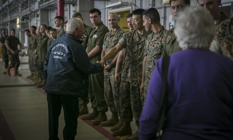 Don Irwin, a U.S. Navy veteran of World War II, shakes Lance Cpl. Hui Xue’s hand April 7, 2017 on Marine Corps Air Station Futenma, Okinawa, Japan. Irwin, who served aboard a number of ships during World War II, took part in battles for Midway and Guadalcanal and survived the sinking of the USS Calhoun during the battle for Okinawa. Irwin returned to Okinawa and exchanged stories with the Marines and Sailors stationed on the island. Irwin is a San Jose, California native and Xue, a New York, New York, native, is an aviation life support system technician with Marine Medium Tiltrotor Squadron 265, Marine Aircraft Group 36, 1st Marine Air Wing, III Marine Expeditionary Force. (U.S. Marine Corps photo by Cpl. Amaia Unanue)