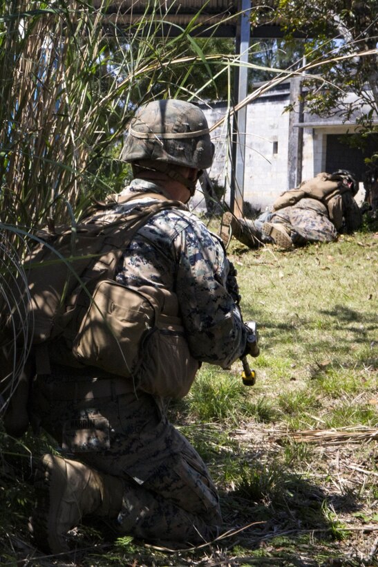 Cpl. Steve Hardin, a team leader with Echo Company, Battalion Landing Team, 2nd Battalion, 5th Marines, 31st Marine Expeditionary Unit, holds security while participating in a mechanized raid as part of Amphibious Integrated Training (AIT) at Marine Corps Base Camp Butler, Okinawa, Japan, March 15, 2017. AIT assimilates the capabilities of the 31st MEU Marine Air-Ground Task Force and the amphibious ships of the Bonhomme Richard Amphibious Ready Group to conduct ship to shore operations. As the Marine Corps' only continuously forward-deployed unit, the 31st Marine Expeditionary Unit's air-ground-logistics team provides a flexible force, ready to perform a wide range of military operations, from limited combat to humanitarian assistance operations, throughout the Indo-Asia-Pacific region. (U.S. Marine Corps photo by Cpl. Darien J. Bjorndal)
