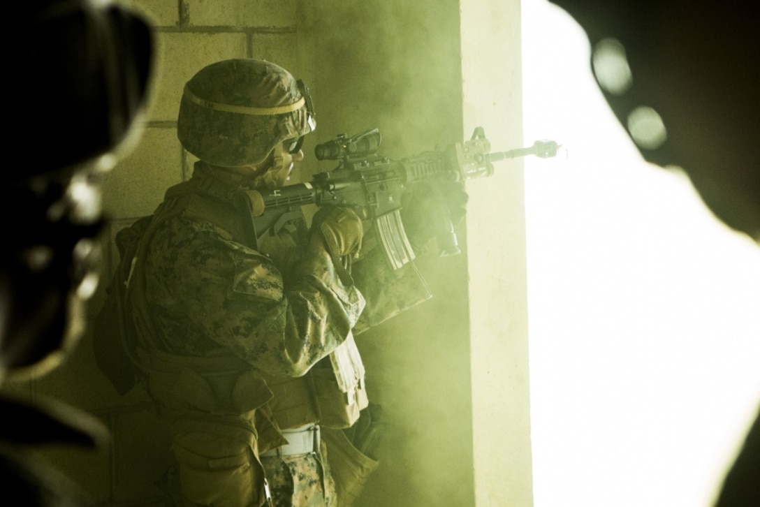 Lance Cpl. Sebastian Czyz, an assault Marine with Echo Company, Battalion Landing Team, 2nd Battalion, 5th Marines, 31st Marine Expeditionary Unit, provides security with an M4 carbine while participating in a mechanized raid as part of Amphibious Integrated Training (AIT) at Marine Corps Base Camp Butler, Okinawa, Japan, March 16, 2017. AIT assimilates the capabilities of the 31st MEU Marine Air-Ground Task Force and the amphibious ships of the Bonhomme Richard Amphibious Ready Group to conduct ship to shore operations. As the Marine Corps' only continuously forward-deployed unit, the 31st Marine Expeditionary Unit's air-ground-logistics team provides a flexible force, ready to perform a wide range of military operations, from limited combat to humanitarian assistance operations, throughout the Indo-Asia-Pacific region. (U.S. Marine Corps photo by Cpl. Darien J. Bjorndal) 