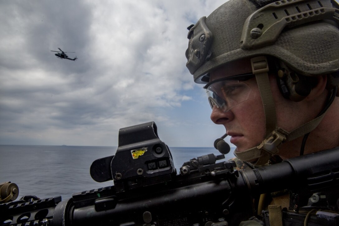 A Force Reconnaissance Marine with Maritime Raid Force, 31st Marine Expeditionary Unit, provides security during a vessel Visit, Board, Search and Seizure exercise aboard the USNS Richard E. Byrd (T-AKE-4), in the Pacific Ocean, March 17, 2017. The MRF specializes in ground and amphibious reconnaissance operations and limited scale raids as the primary reconnaissance and battlespace shaping element of the 31st MEU. 31st MEU conducts VBSS training as a part of the 31st MEU’s 17.1 Spring Patrol of the Asia-Pacific region. As the Marine Corps’ only continuously forward deployed unit, the 31st MEU’s air-ground-logistics team provides a flexible force, ready to perform a wide range of military operations, from limited combat to humanitarian assistance operations, throughout the Asia-Pacific region. (U.S. Marine Corps photo by Cpl. Jona R. Meme/Released)