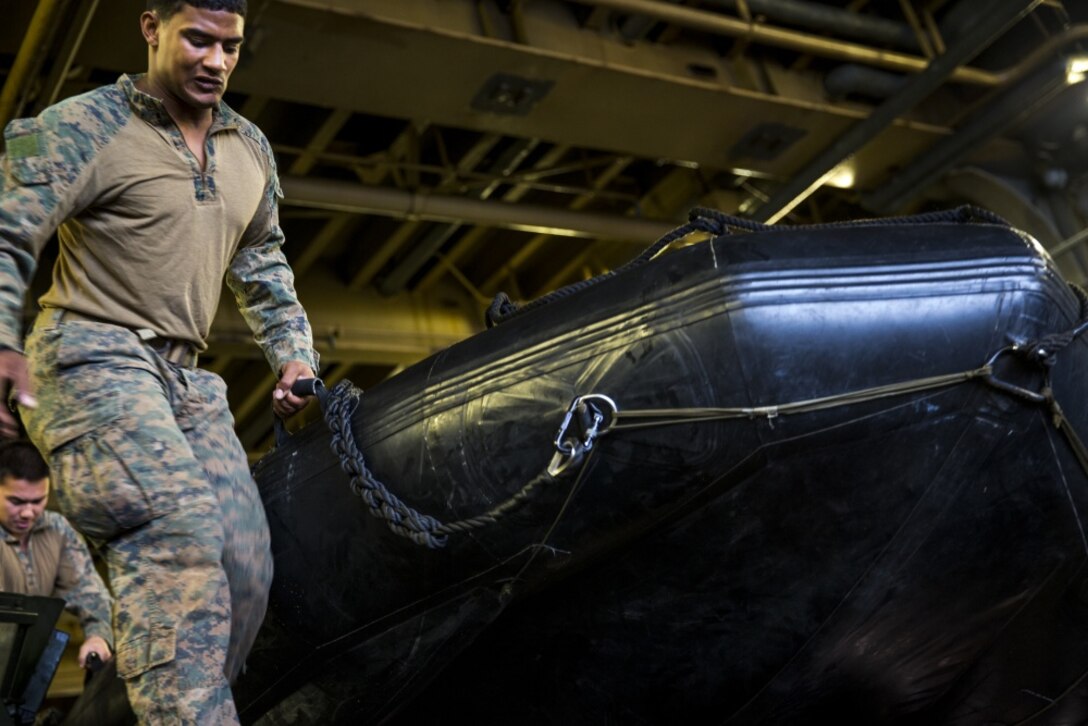 A reconnaissance Marine with the Amphibious Reconnaissance Platoon, 31st Marine Expeditionary Unit, carries a combat rubber raiding craft during a helo-casting exercise aboard the USS Bonhomme Richard (LHD 6), in the Pacific Ocean, March 19, 2017. Helo-casting is a method for inserting reconnaissance and surveillance teams in support of small boat operations. The ARP specializes in ground and amphibious reconnaissance operations as the primary reconnaissance and surveillance element of the 31st MEU. 31st MEU conducted helo-cast training as a part of their 17.1 Spring Patrol of the Asia-Pacific region. As the Marine Corps’ only continuously forward deployed unit, the 31st MEU’s air-ground-logistics team provides a flexible force, ready to perform a wide range of military operations, from limited combat to humanitarian assistance operations, throughout the Asia-Pacific region. (U.S. Marine Corps photo by Cpl. Jona R. Meme/Released) 