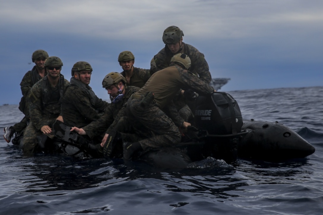 Commanding Officer Colonel Ty Wallace, Sergeant Major Jim Lanham and Marines with Command Element, 31st Marine Expeditionary Unit, board a combat rubber raid craft during a helo-casting exercise in the Pacific Ocean, March 19, 2017. Helo-casting is a method for inserting reconnaissance and surveillance teams in support of small boat operations. The 31st MEU conducted helo-cast training as a part of their 17.1 Spring Patrol of the Asia-Pacific region. As the Marine Corps’ only continuously forward deployed unit, the 31st MEU’s air-ground-logistics team provides a flexible force, ready to perform a wide range of military operations, from limited combat to humanitarian assistance operations, throughout the Asia-Pacific region. (U.S. Marine Corps photo by Cpl. Jona R. Meme/Released) 