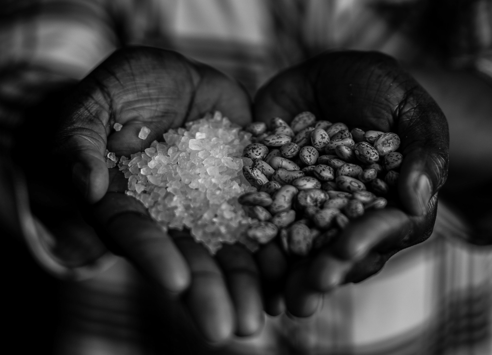 Staff Sgt. Martha Otto, 86th Logistics Readiness Squadron training manager and former South-Sudanese refugee, holds salt and beans, the two items she distinctly remembers carrying during her 381-mile walk in search of safety. At the age of seven, the Ramstein Airman, was responsible for carrying a sack of salt as her family’s currency to trade for vegetables and beans, as they made their dangerous journey through the woodlands to a refugee camp in Northern Uganda. (U.S. Air Force photo by Staff Sgt. Nesha Humes)