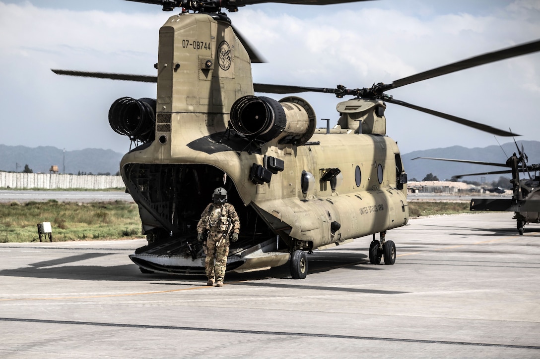 An Army crew chief prepares a UH-60 Black Hawk helicopter for a flight at Operating Base Fenty, Afghanistan, April 5, 2017. The crew chief is assigned to the 7th Infantry Division's Task Force, 16th Combat Aviation Brigade. Army photo by Capt. Brian Harris