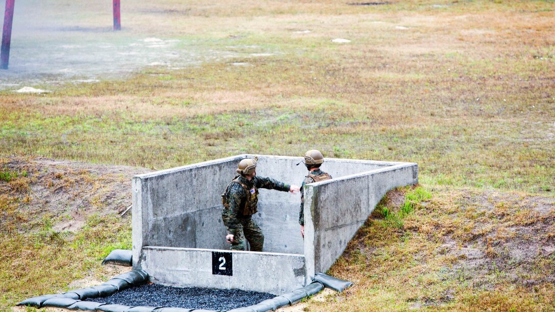A Marine throws an M67 fragmentation grenade during a grenade range at Marine Corps Base Camp Lejeune, N.C., March 31, 2017. The training helped Marines build trust and confidence in each other by refining the skills needed to operate in a combat environment. The Marines are with 2nd Reconnaissance Battalion. 