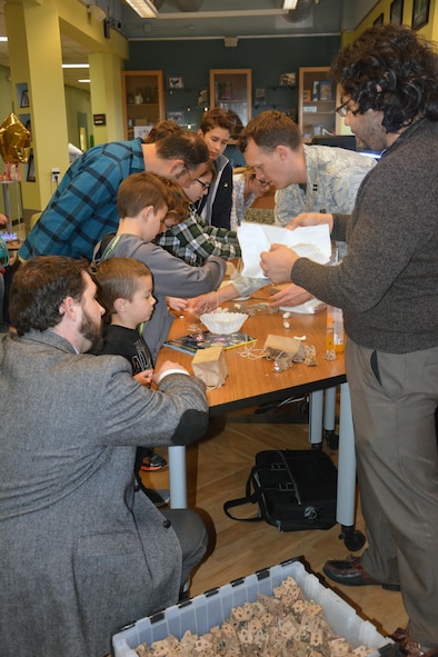 Capt. Nathaniel Opie (center) and Manny Gonzales (right) instruct visitors at the Air Force Research Laboratory’s Materials and Manufacturing Directorate Open House on basic aerodynamics and flight. More than 200 guests, family members and friends of the laboratory participated in the inaugural Open House event, held in celebration of its 100 year anniversary this year. (U.S. Air Force photo/David Dixon)

EDITOR'S NOTE:  Parental Minor Release signed 12 April 2017