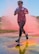 A runner moves through a pink cloud of powder toward the finish line during the 4th annual Color Me Aware Fun Run April 6 near the Civil Engineer Pavilion at Eglin Air Force Base, Fla. The run is held to raise sexual assault awareness. (U.S. Air Force photo/Ilka Cole) 