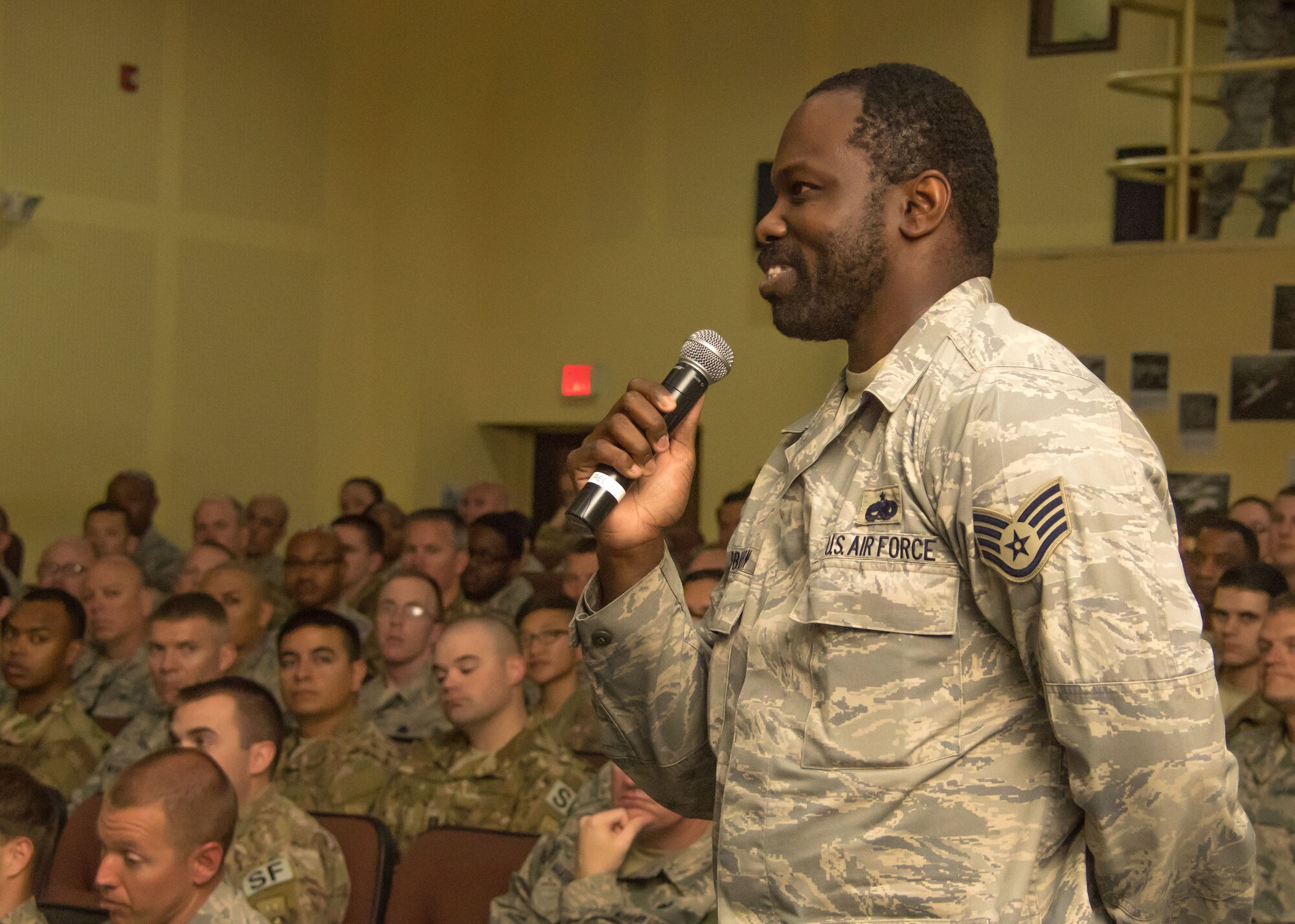 An Airman asks a question during the all call led by the Vice Chief of Staff of the U.S. Air Force and Chief Master Sergeant of the Air Force at an undisclosed location in Southwest Asia April 9, 2017. During the question and answer session, both Wilson and Wright addressed concerns ranging from the lack of certain services in forward-deployed locations to future possibilities for enlisted members to fly unmanned aircraft. (U.S. Air Force photo/Staff Sgt. Andrew Park)