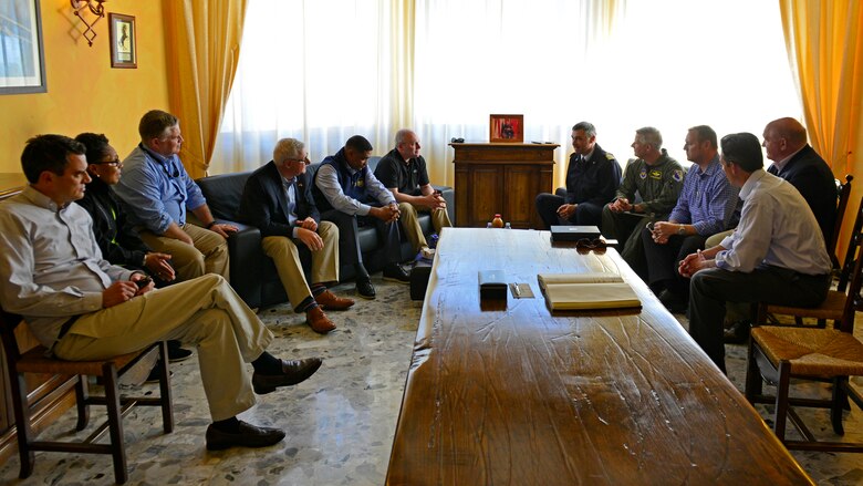 Nine state representatives meet with Italian air force Col. Stefano Cianfrocca, Aviano Air Base commander (center right), during their visit to Aviano Air Base, Italy, April 8, 2017. During their visit, the group also met with residents from their respective states. (U.S. Air Force photo by Senior Airman Cary Smith)