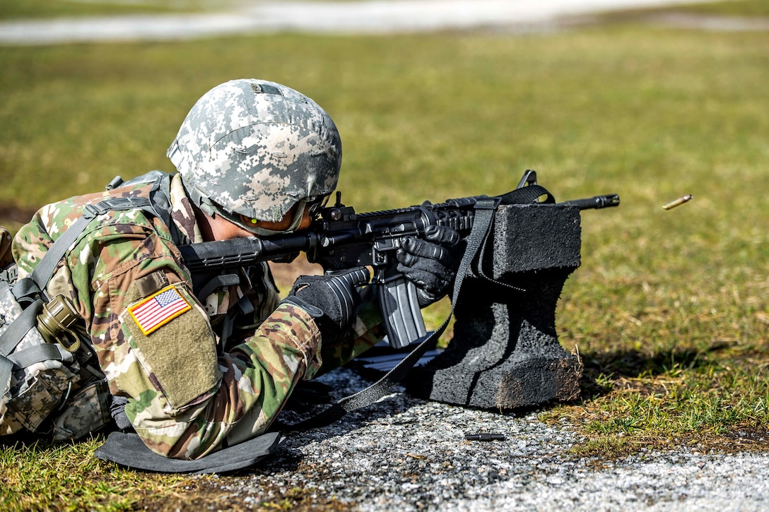 New York Army National Guard Pfc. Julius Forde zeroes his weapon before shooting in a weapon qualification event during the New York Army National Guard Best Warrior Competition at Camp Smith, New York, March 30, 2017. The Best Warrior competitors represent each of New York's brigades after winning competitions at all levels. Army National Guard photo by Sgt. Harley Jelis 