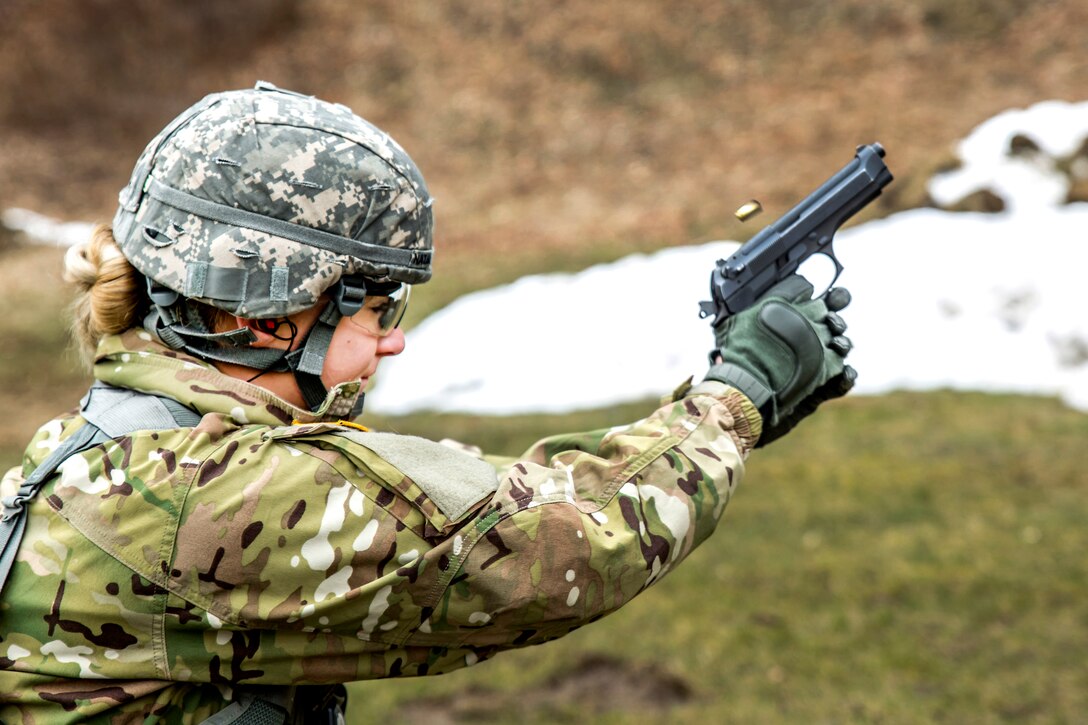 New York Army National Guard Spc. Courtney Natal qualifies for the German Armed Forces Proficiency Badge with an M9 pistol during the New York Army National Guard Best Warrior Competition at Camp Smith, New York, March 30, 2017. Army National Guard photo by Sgt. Harley Jelis