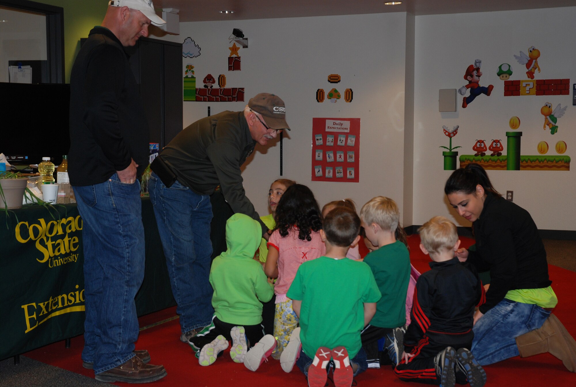 PETERSON AIR FORCE BASE, Colo. – Ron Meyer, Colorado State Extension area agronomist, shows unusual planting media to a group of school aged children at the R.P. Lee Youth Center, Peterson Air Force Base, Colo., March 27, 2017, during the CSU Extension’s AgFest. (U.S. Air Force Photo by Dave Smith)