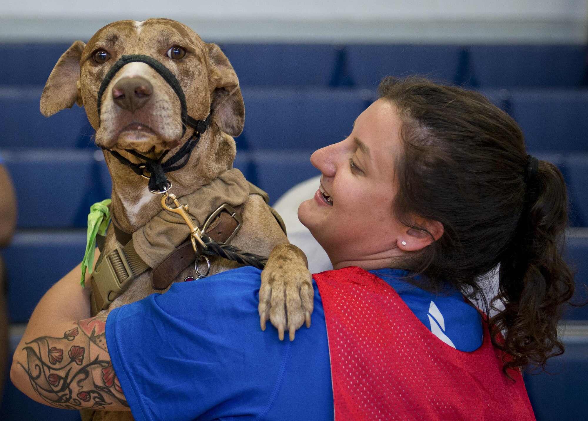 Retired Senior Airman Hannah Stolberg, and her service dog, Valhalla, share a moment during the adaptive sports camp at Eglin Air Force Base, Fla., April 2016.  The base will hosts the week-long Warrior CARE event again this year, helping recovering wounded, ill and injured military members through specific hands-on rehabilitative training.  (U.S. Air Force photo/Samuel King Jr.)