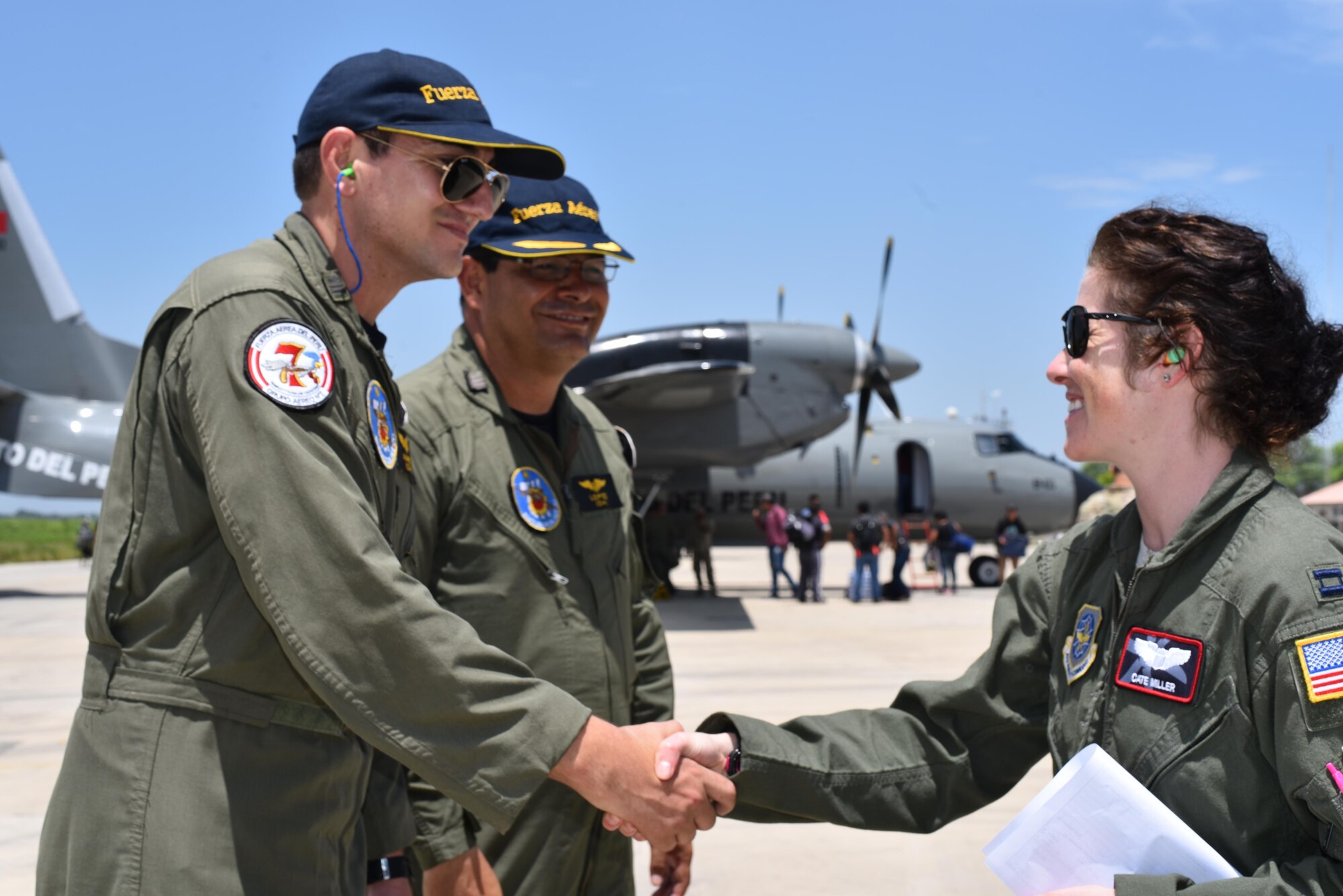 On the very first day of deliveries, U.S. Air Force Capt. Caitlin Miller, 41st Airlift Squadron aircraft commander, meets members from the Callao's Air group No. 8. at the airfield in Piura, Peru on April 6, 2017. The 41st Airlift Squadron delivered 27,900 pounds of disaster relief supplies to Chiclayo, Peru.  (U.S. Air Force photo by Staff Sgt. Jael Laborn)
