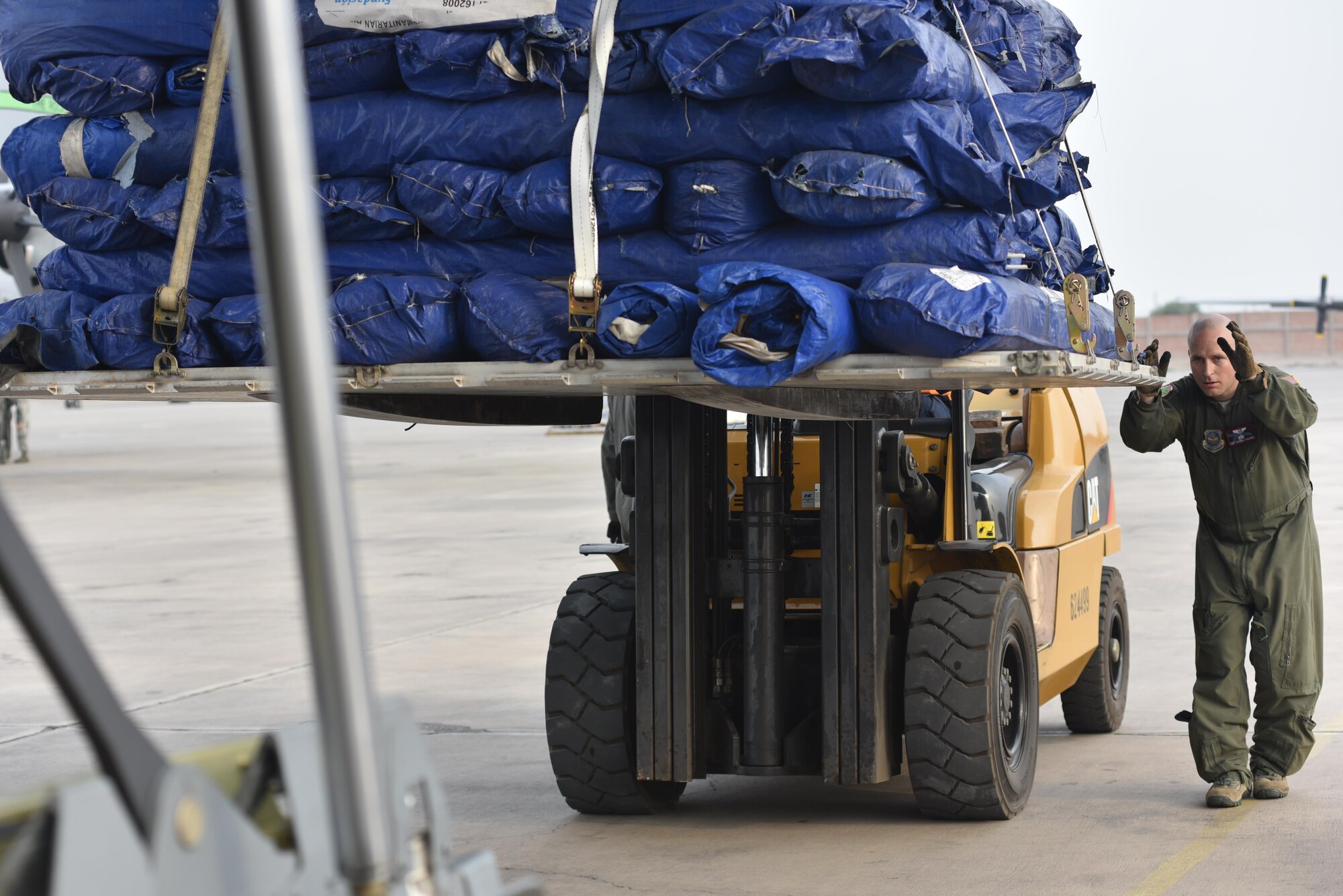 U.S. Air Force Staff Sgt. George Childres, 41st Airlift Squadron loadmaster, off loads cargo from a C-130J April 6, 2017, in Lima, Peru. Two C-130Js from Little Rock Air Force Base, Ark., were launched at the request of the Government of Peru to assist humanitarian operations to recover from the disaster created by unforeseen flooding and resulting landslides. (U.S. Air Force photo by Staff Sgt. Jael Laborn) 