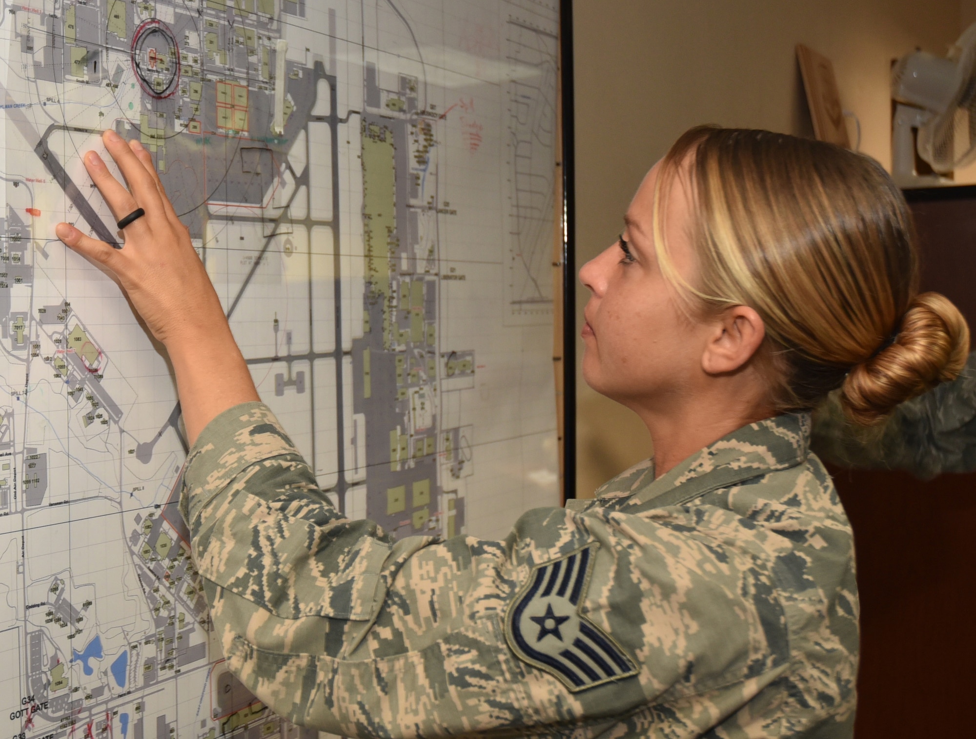 Staff Sgt. Lara, 552nd Air Control Wing Command Post Controller, plots an incident location during a recent exercise.  Sergeant Lara was recently named the Air Combat Command’s Command Post Non-Commissioned Officer for 2016. (Air Force photo by Ron Mullan)