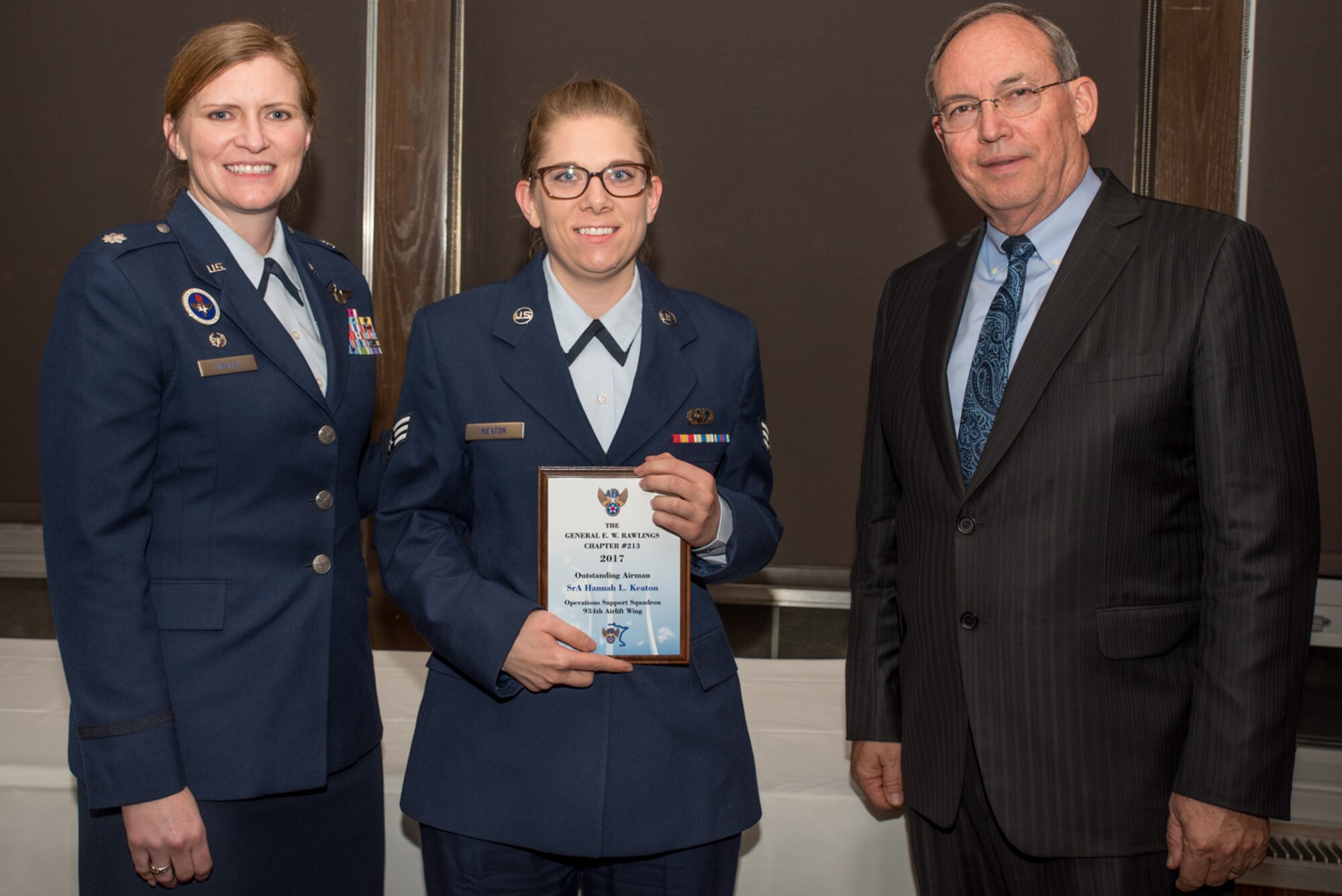 Lt. Col. Lizabeth Wenzel, commander of the Air Force ROTC Detachment 415 at the University of Minnesota, and retired Air Force Lt. Gen. David Deptula, dean of the Mitchell Institute for Aerospace Power Studies, present Senior Airman Hannah Keaton, an Intel Specialist with the 934th Operations Support Squadron, the Outstanding Airman of the Year Award
 at the Air Force Association’s 2017 Awards Dinner sponsored by the General E. W. Rawlings Chapter, April 7 at the Town & Country Club in St. Paul, Minn. (U.S. Air Force photo by Master Sgt. Eric Amidon)