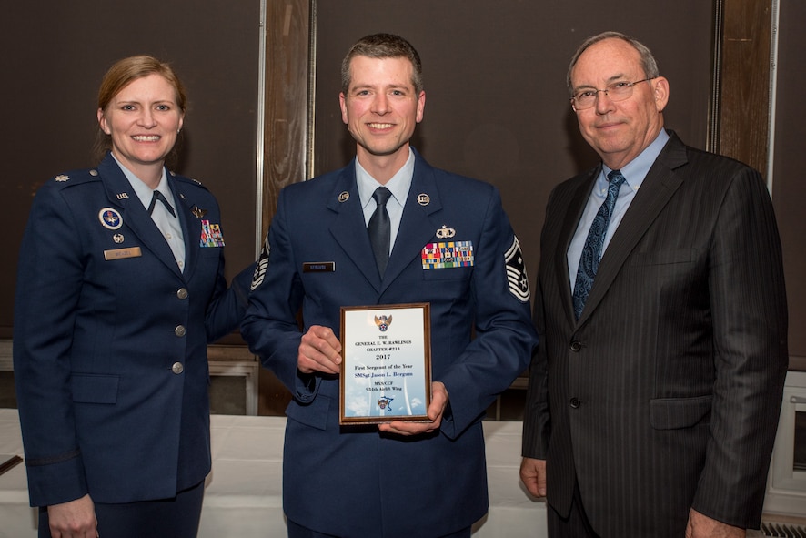 Lt. Col. Lizabeth Wenzel, commander of the Air Force ROTC Detachment 415 at the University of Minnesota, and retired Air Force Lt. Gen. David Deptula, dean of the Mitchell Institute for Aerospace Power Studies, present Senior Master. Sgt. Jason Bergum, the 934th Maintenance  Squadron first sergeant, the First Sergeant of the Year Award at the Air Force Association’s 2017 Awards Dinner sponsored by the General E. W. Rawlings Chapter, April 7 at the Town & Country Club in St. Paul, Minn. (U.S. Air Force photo by Master Sgt. Eric Amidon)