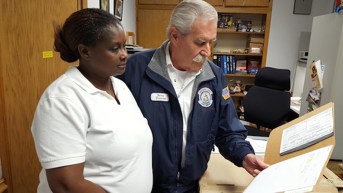 Doug Thomas and Stephanie Tolliver-Clarke, 97th Maintenance Directorate production controllers, inspect a drawing
of an aircraft part, April 29, 2017, Altus Air Force Base, Oklahoma. The local manufacture element facilitates the organic manufacture of aircraft parts needed for repairs and maintenance. (courtesy photo/ released)