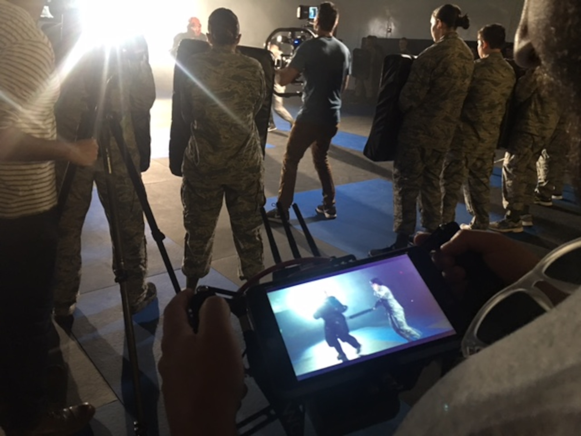 A camera crew films Security Forces Instructors and trainees from the 343rd Training Group, Joint Base San Antonio-Lackland, Texas, during combatives training. The Profession of Arms Center of Excellence filmed at JBSA-Lackland March 1, for the Heritage Today video, “Defenders.”  