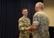 Staff Sgt. Zac Hakinson, 114th Communication Flight information technology specialist, is congratulated by members of the 114th Fighter Wing after receiving his college diploma from Dakota State University April 11, 2017, Joe Foss Field, S.D. Hakinson received his diploma prior to deploying for a Reserve Component Period. (U.S. Air National Guard photo by Staff Sgt. Duane Duimstra/Released) 