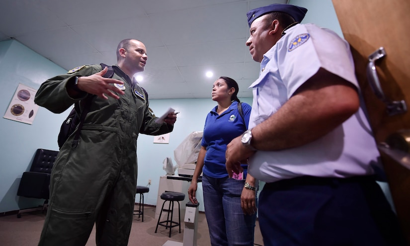 U.S. Air Force Capt. Ricardo Sequeira, 628th Medical Operations Support Squadron and 14th Airlift Squadron flight surgeon, Joint Base Charleston, South Carolina, left, tours a Honduran air force medical clinic as part of a subject matter expert exchange in Tegucigalpa, Honduras, April 4. The global health engagement brought U.S. and Honduran counterparts together to build and strengthen partner relationships.