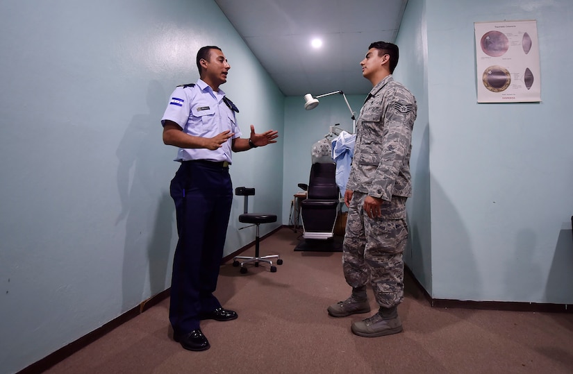 U.S. Air Force Staff Sgt. Gabriel Trujillo, 779th Medical Operations Squadron paramedic, Joint Base Andrews, Maryland, right, tours a medical clinic alongside Honduran air force Subteniente Auxiliar Sanidad Obed Antonio Contreres Fuentes, left, as part of a subject matter expert exchange in Tegucigalpa, Honduras, April 4. The global health engagement brought U.S. and Honduran counterparts together to build and strengthen partner relationships.