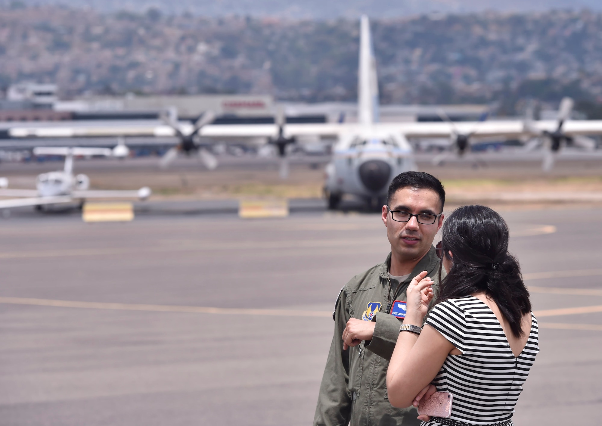 U.S. Air Force Tech. Sgt. Johann Bermudez, U.S. Air Force School of Aerospace Medicine aeromedical evacuation instructor, Wright-Patterson Air Force Base, Ohio, talks about aerospace medicine best practices with Marcela Servellon, Honduran government, Colonial Monterrey doctor of medicine, as part of a subject matter expert exchange with members of the Honduran Air Force in Tegucigalpa, Honduras, April 4. The global health engagement brought U.S. and Honduran counterparts together to build and strengthen partner relationships.