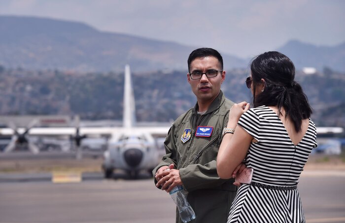 U.S. Air Force Tech. Sgt. Johann Bermudez, U.S. Air Force School of Aerospace Medicine aeromedical evacuation instructor, Wright-Patterson Air Force Base, Ohio, talks about aerospace medicine best practices with Marcela Servellon, Honduran government, Colonial Monterrey doctor of medicine, as part of a subject matter expert exchange with members of the Honduran Air Force in Tegucigalpa, Honduras, April 4. The global health engagement brought U.S. and Honduran counterparts together to build and strengthen partner relationships.