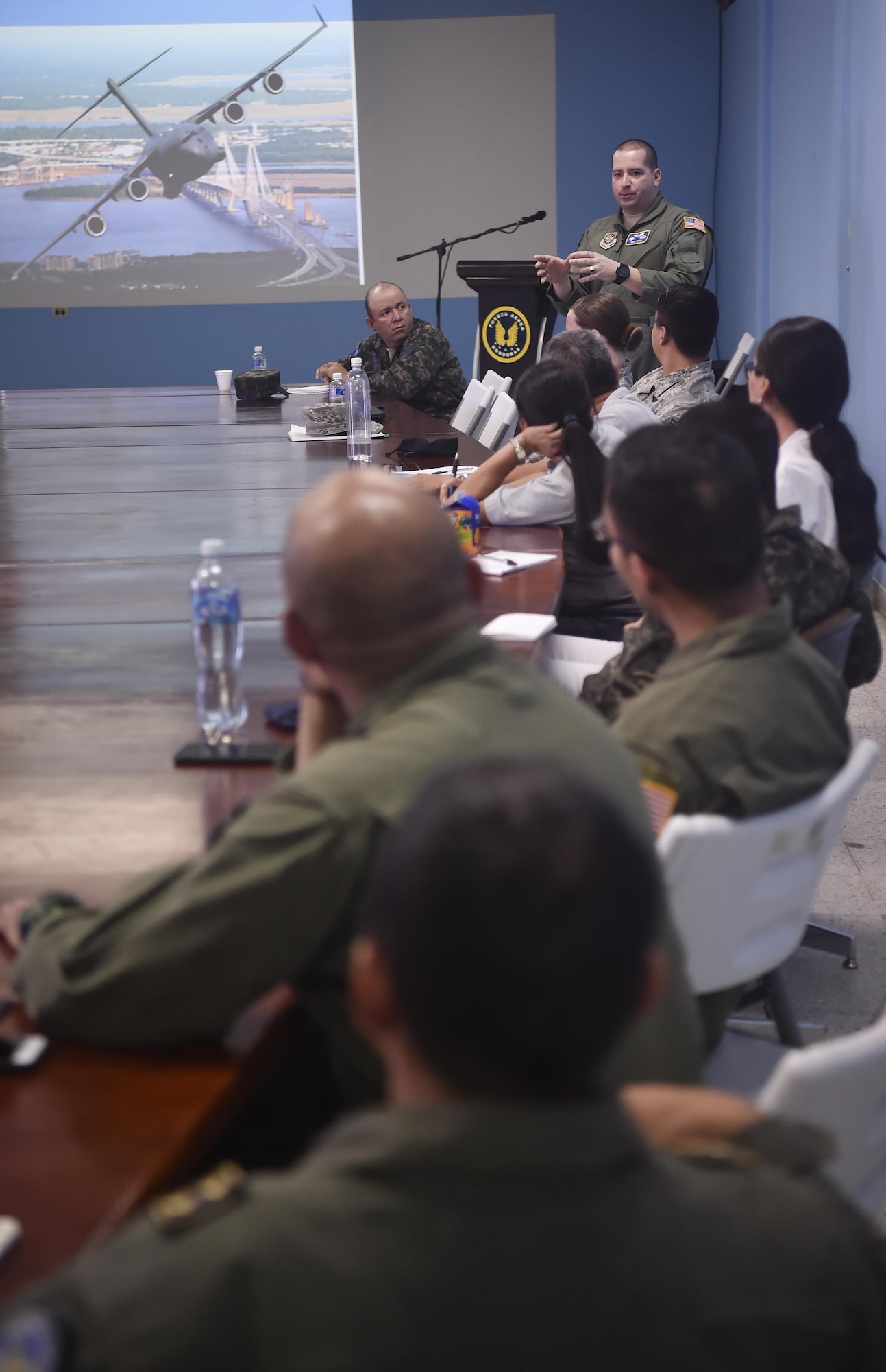 U.S. Air Force Capt. Diego Torres, Detachment 4, 375th Operations Group flight nurse instructor and evaluator, Wright-Patterson Air Force Base, Ohio, facilitates a conversation about aerospace medicine involving U.S. and Honduran air force members during an aerospace medicine subject matter expert knowledge exchange in Tegucigalpa, Honduras, April 5. The global health engagement brought U.S. and Honduran counterparts together to build and strengthen partner relationships.